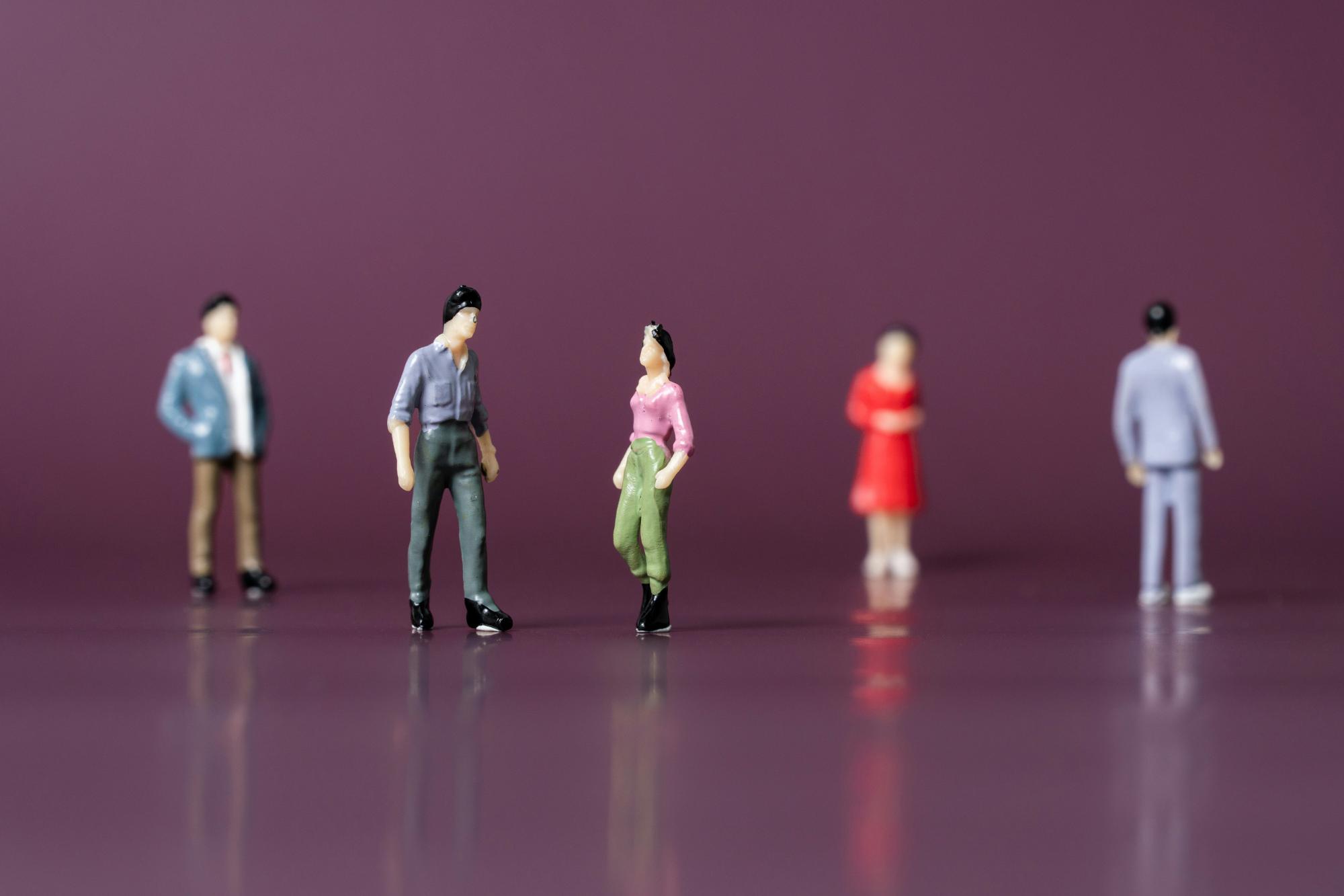 The limited role for RSHE in tackling shool sexism - image of female and male figurines on a purple background