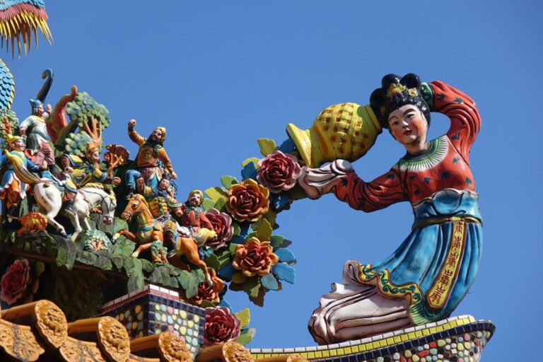 Q&A with historian supporter Joseph Lawson - image of a colourful Tiwanese statue depicting a woman pouring flowers from a vase over fighting men